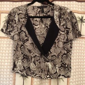 BCBG short sleeved animal print silk blouse size XS